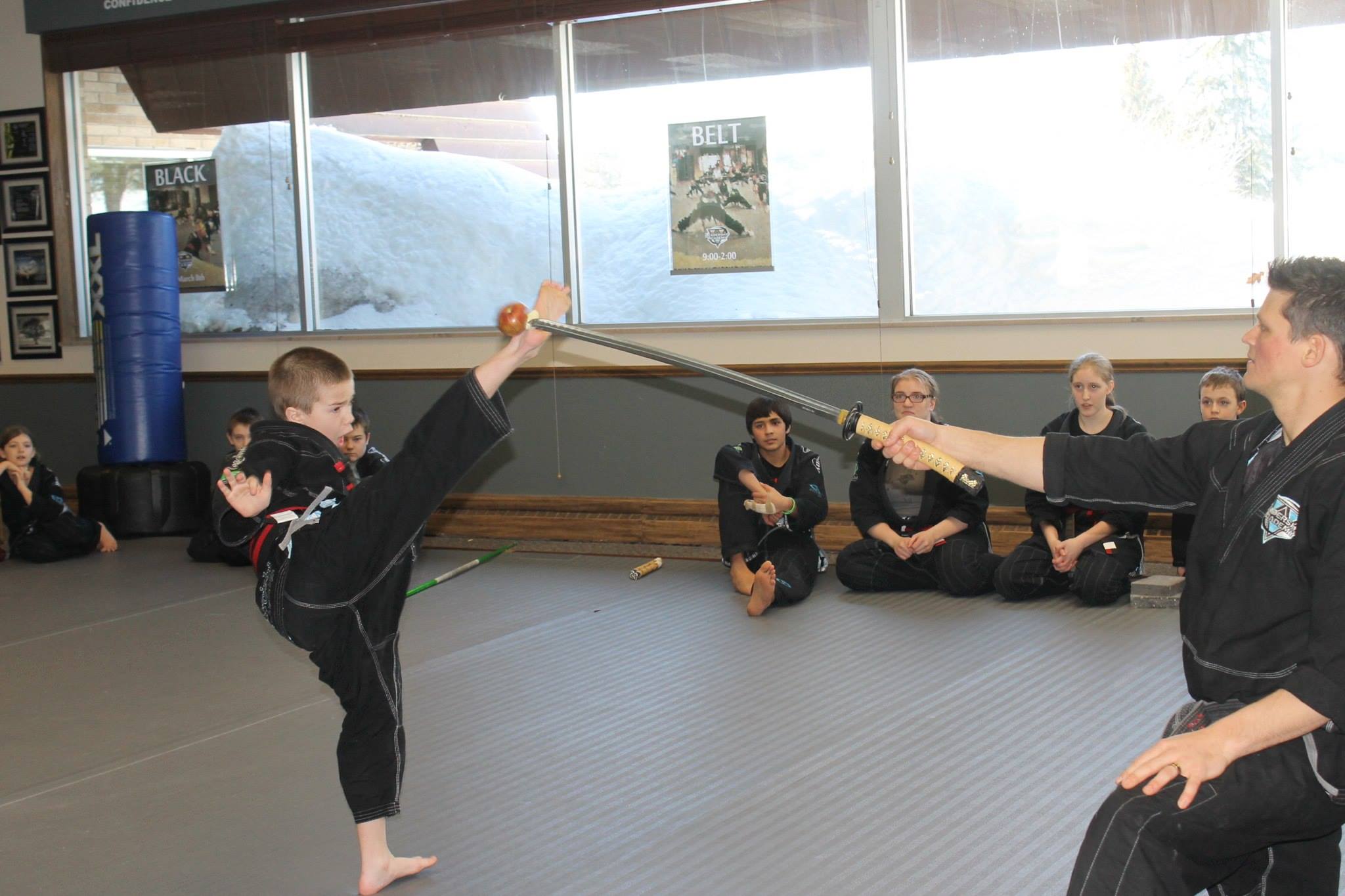 Instructor coaching candidates during Black Belt testing
