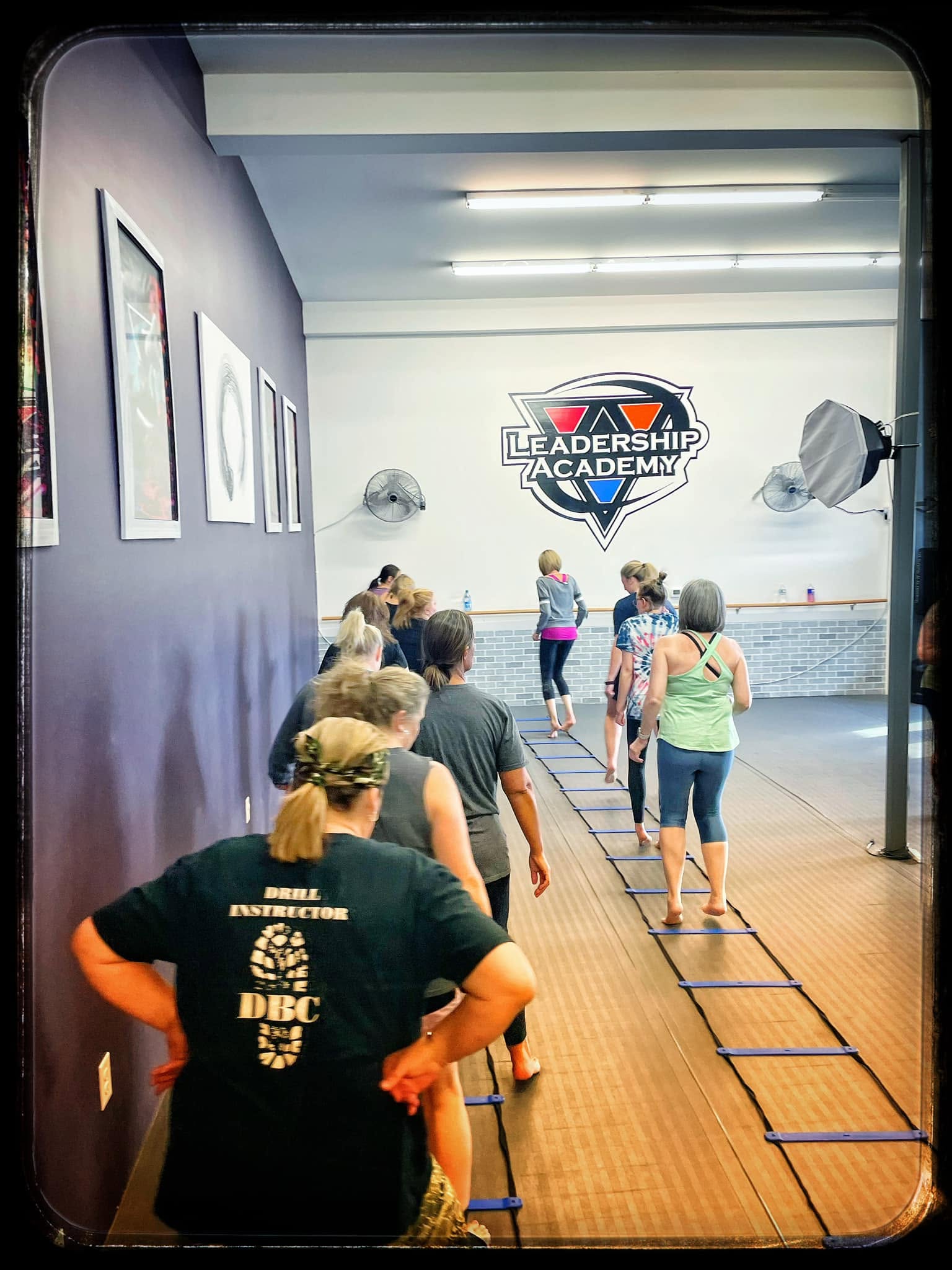 Women moving through an agility ladder drill
