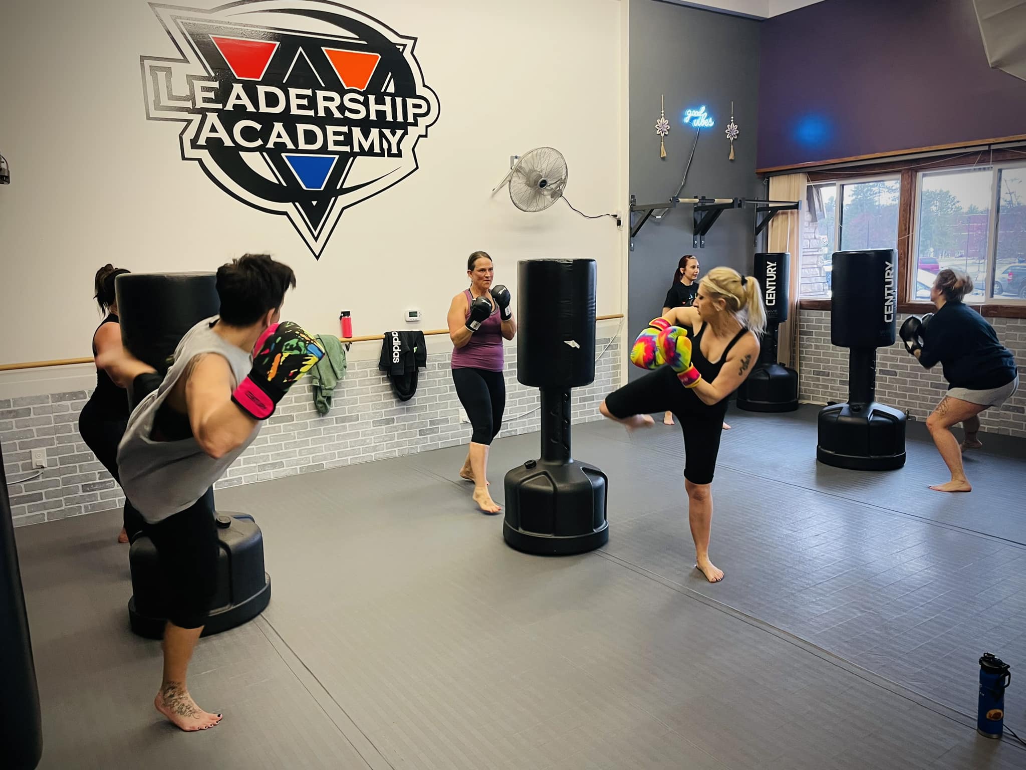Women's fitness kickboxing class at Leadership Academy